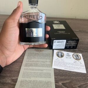Creed Aventus Bottle with Black and Silver Design